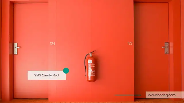 Corridor door refinished in a bright red Bodaq solid film